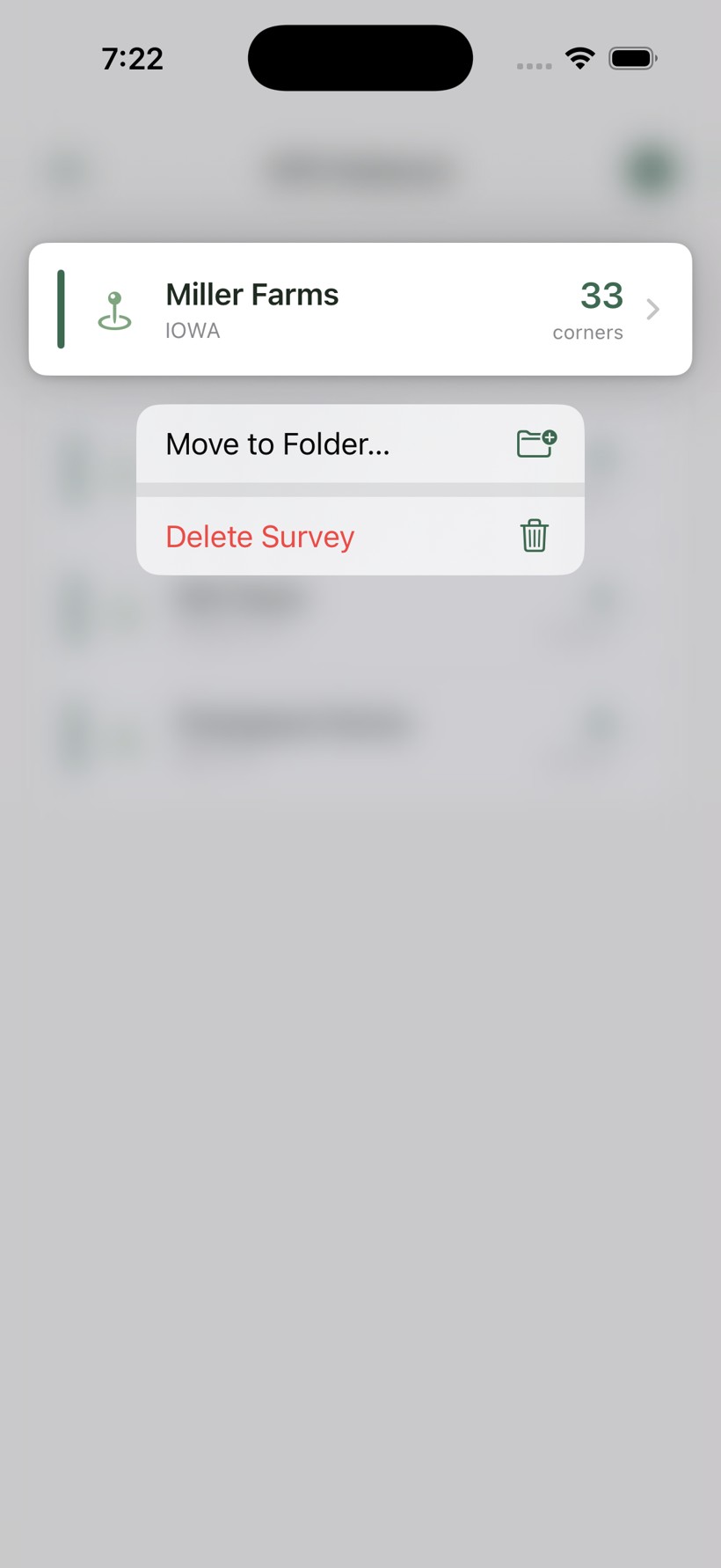 Plat list with a long-press menu open showing Move to Folder and Delete Survey options