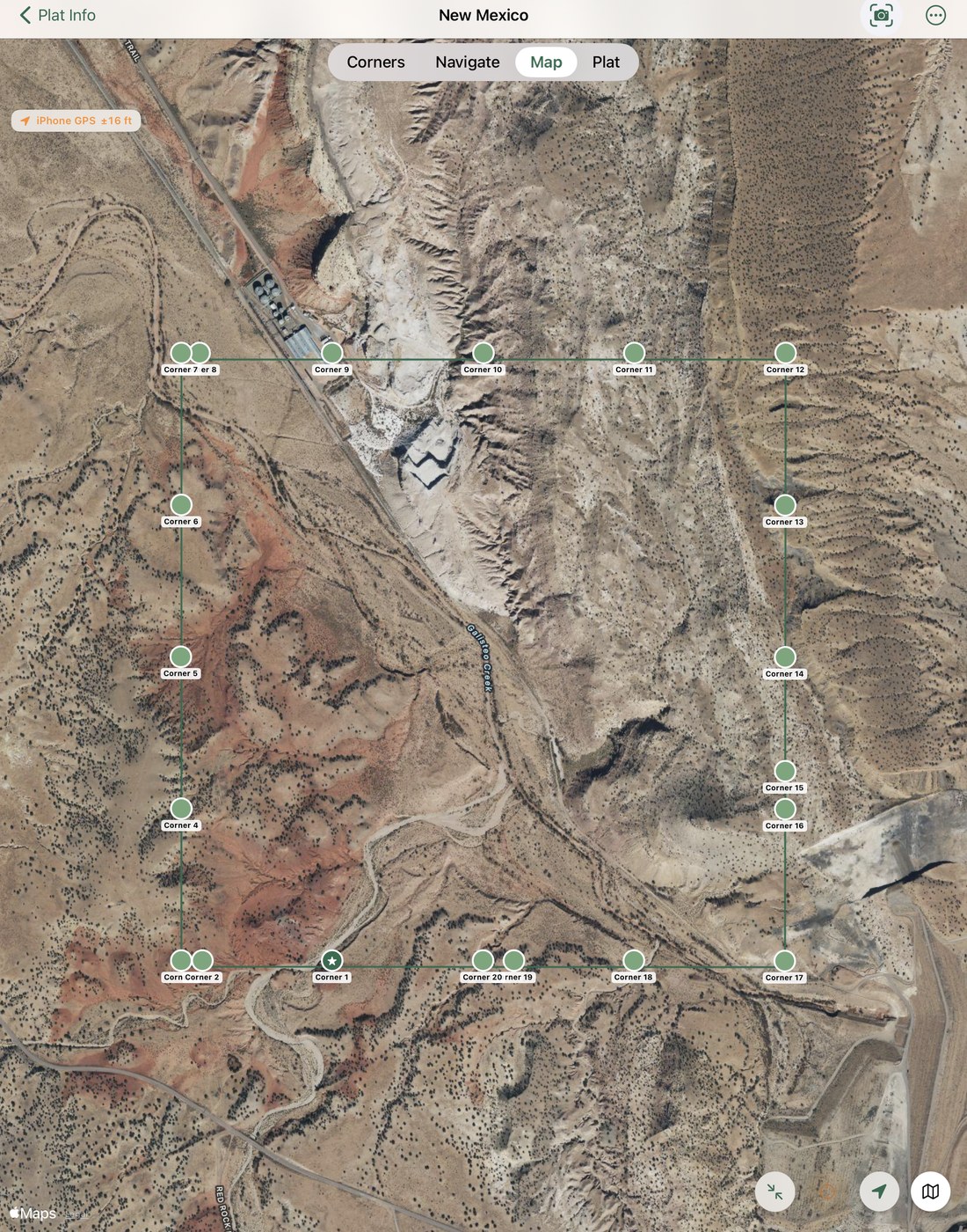 A PLSS section plotted on satellite imagery — the rectangular section boundary with numbered corners overlaid on desert terrain